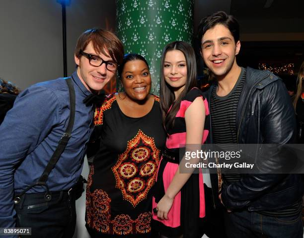 Actors Josh Peck, Yvette Nicole Brown, Miranda Cosgrove, and Drake Bell attend the after party for "Merry Christmas, Drake & Josh!" at the Westside...