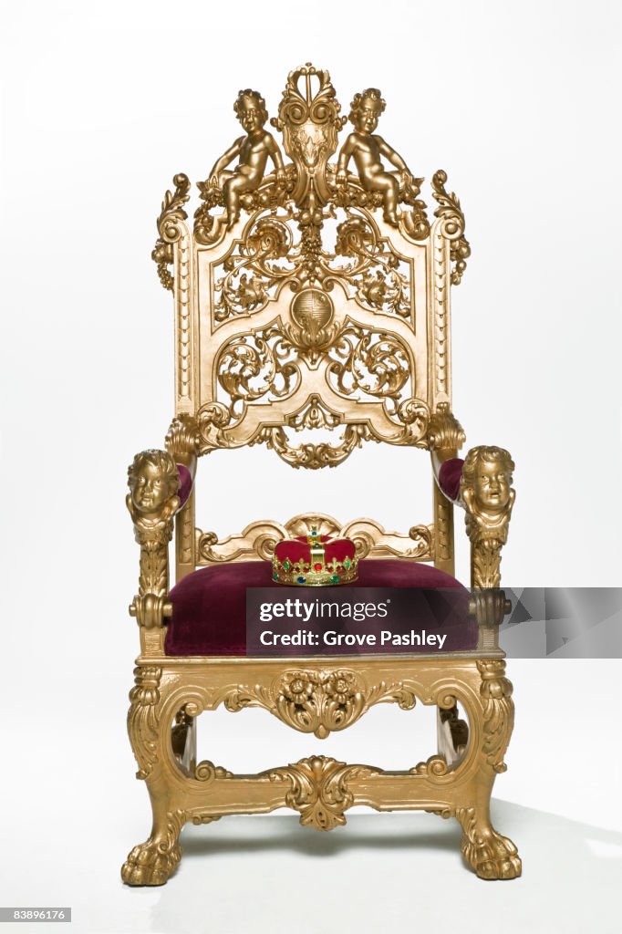 Kings crown sitting on throne