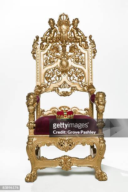 kings crown sitting on throne - throne stock pictures, royalty-free photos & images