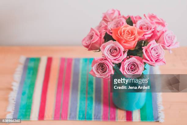 individuality concept roses in a vase - jena rose stock-fotos und bilder