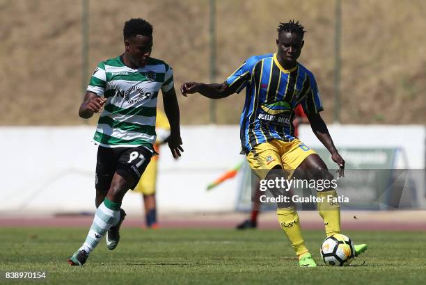 Real SC midfielder Brash from Guinea Bissau with Sporting CP B forward Jovane Cabral in action during the Segunda Liga match between Real SC and...