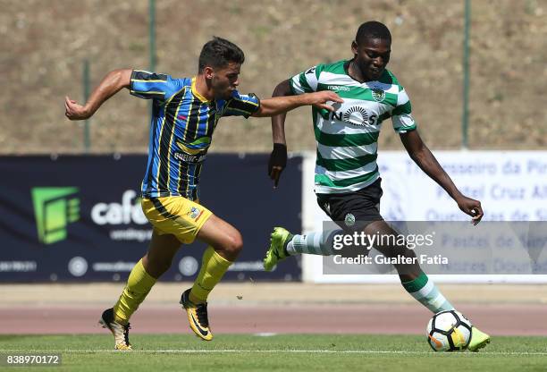 Sporting CP B forward Rafael Leao with Real SC defender Jorge Bernardo from Portugal in action during the Segunda Liga match between Real SC and...