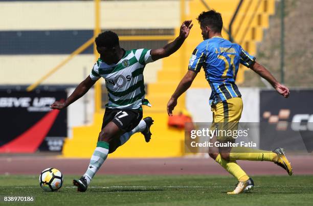 Sporting CP B forward Jovane Cabral with Real SC defender Jorge Bernardo from Portugal in action during the Segunda Liga match between Real SC and...