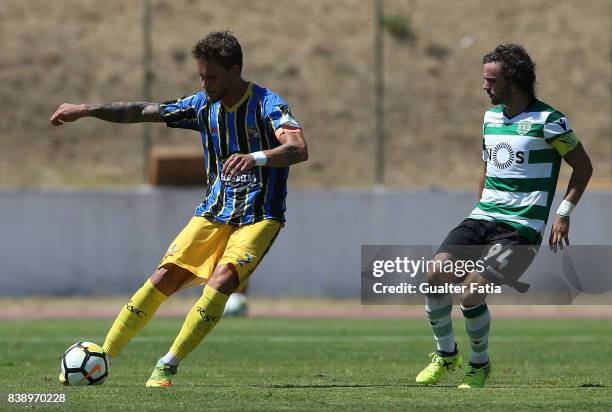 Real SC defender Vasco Coelho from Portugal with Sporting CP B midfielder Rafael Barbosa in action during the Segunda Liga match between Real SC and...