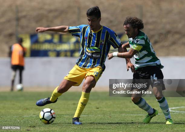 Real SC defender Joao Basso from Brazil with Sporting CP B midfielder Rafael Barbosa in action during the Segunda Liga match between Real SC and...