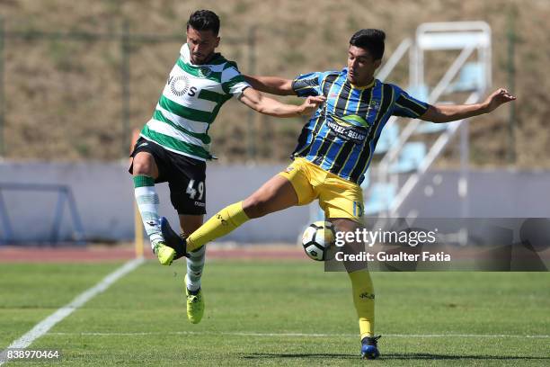 Sporting CP B midfielder Cristian Ponde with Real SC defender Joao Basso from Brazil in action during the Segunda Liga match between Real SC and...