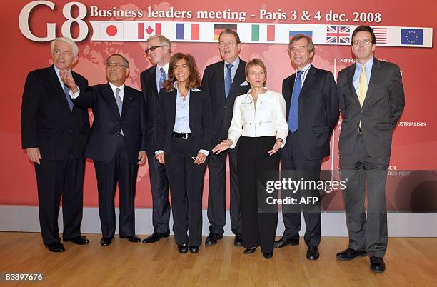 Seven business leaders pose along with French employers association Medef head Laurence Parisot prior to the start of a "G8 business leaders meeting"...