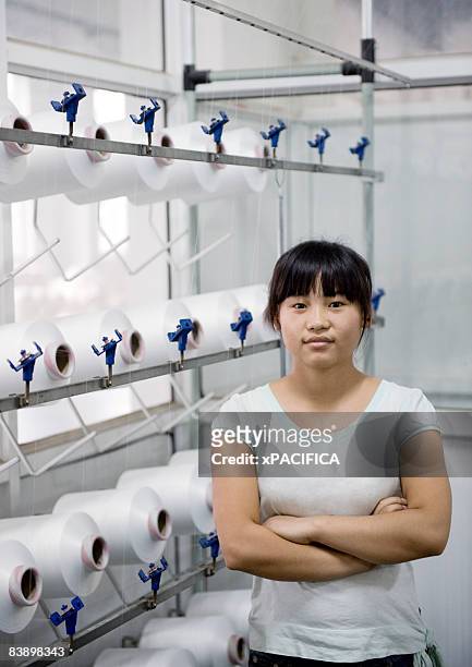 a portrait of a textile factory employee. - tee reel stock pictures, royalty-free photos & images