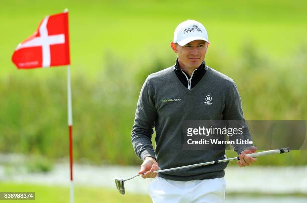 Lasse Jensen of Denmark walks off the 18th green after finishing his round during day two of Made in Denmark at Himmerland Golf & Spa Resort on...