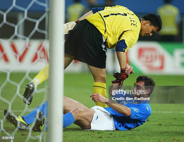 Woon Jae Lee of South Korea helps up Christian Vieri of Italy after he misses a sitter during the FIFA World Cup Finals 2002 Second Round match...