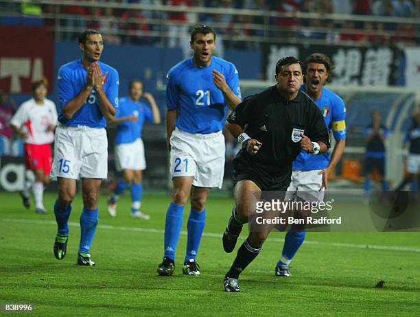 Mark Iuliano, Christian Vieri and captain Paolo Maldini of Italy complain to referee Byron Moreno of Ecuador during the FIFA World Cup Finals 2002...