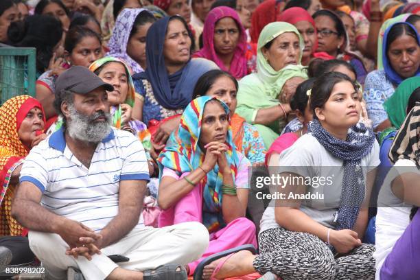 Dera followers gather to protest after the Dera chief verdict at CBI court on August 25, 2017 in Panchkula, India. Gurmeet Ram Rahim, the self-styled...