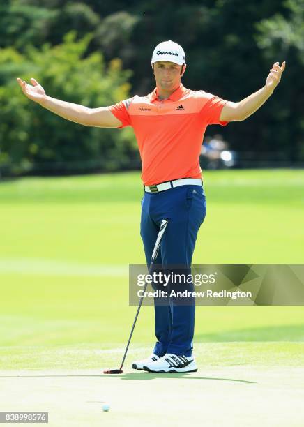 Jon Rahm of Spain reacts after missing a putt on the eighth green during round two of The Northern Trust at Glen Oaks Club on August 25, 2017 in...