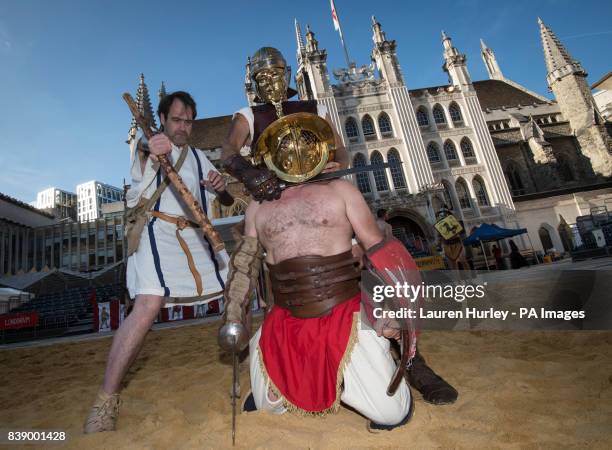 Gladiators attend a photo call for the Gladiator Games at the Museum of London's Roman Amphitheatre.