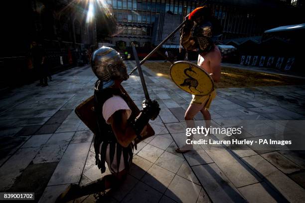 Gladiators attend a photo call for the Gladiator Games at the Museum of London's Roman Amphitheatre.