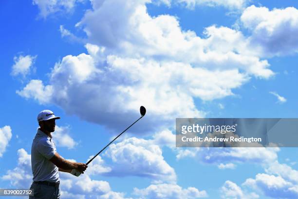 Dustin Johnson of the United States plays his shot from the ninth tee during round two of The Northern Trust at Glen Oaks Club on August 25, 2017 in...