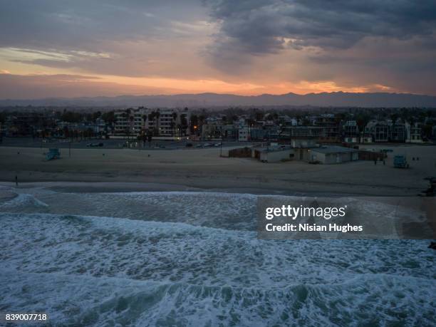 aerial flying past venice beach los angeles, ca sunrise - venice california stock pictures, royalty-free photos & images