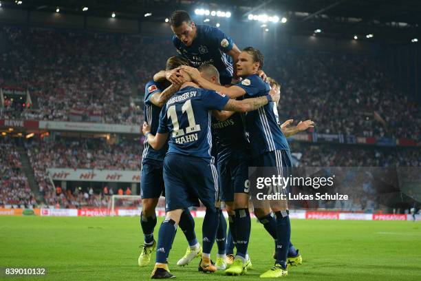 Andre Hahn of Hamburg and Filip Kostic of Hamburg celebrate with team mates after Hahn scored his teams first goal during the Bundesliga match...