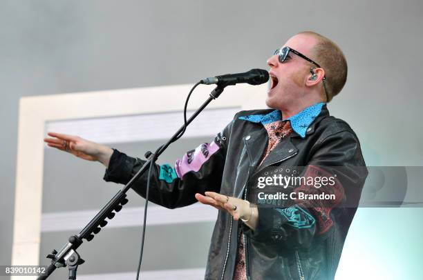 Alex Trimble of Two Door Cinema Club performs on stage during Day 1 of the Reading Festival at Richfield Avenue on August 25, 2017 in Reading,...