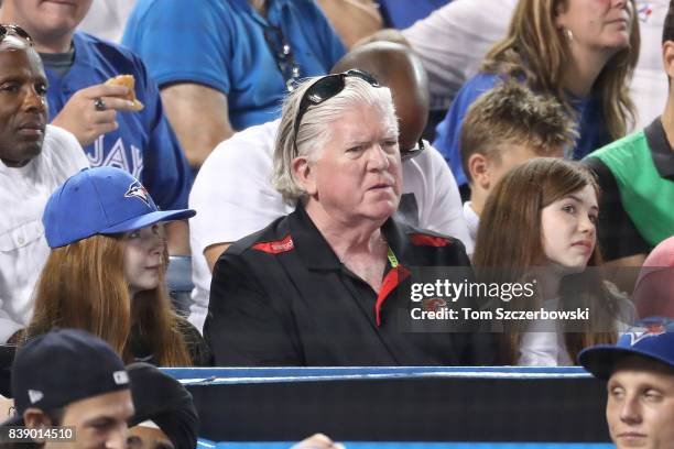 President of hockey operations Brian Burke of the Calgary Flames watches the Toronto Blue Jays MLB game against the New York Yankees at Rogers Centre...