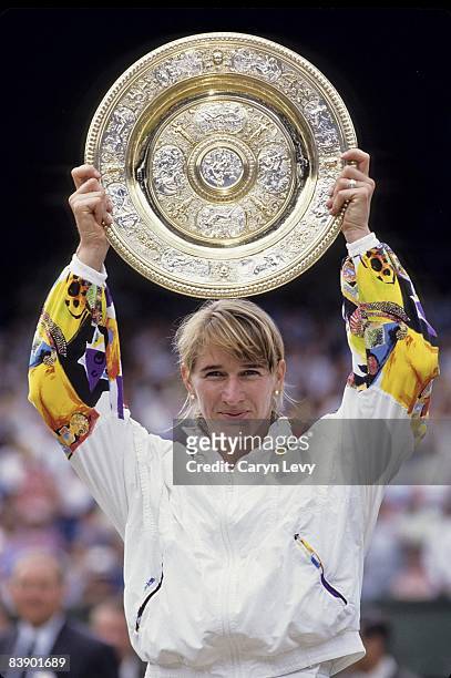 Germany Steffi Graf victorious with Rosewater Dish trophy after winning Finals match vs Czech Republic Jana Novotna at All England Club. London,...