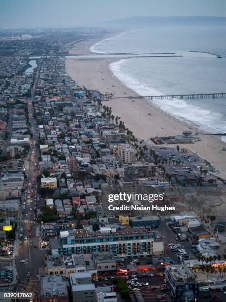 aerial flying over santa monica in los angeles, ca sunset - manhattan beach stock pictures, royalty-free photos & images