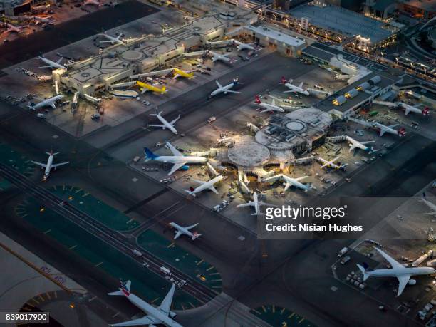 aerial flying over los angeles international airport, ca night - airplane lights stock pictures, royalty-free photos & images