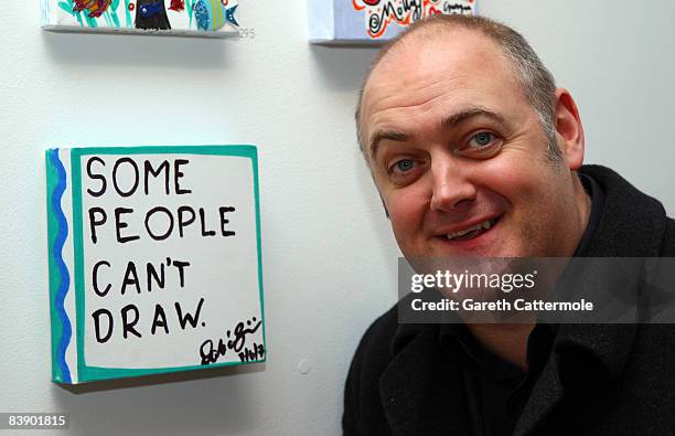 Comedian Dara O'Briain poses with his canvas at the 'Stars On Canvas' Private View at the SW1 Gallery on December 3, 2008 in London, England. The...