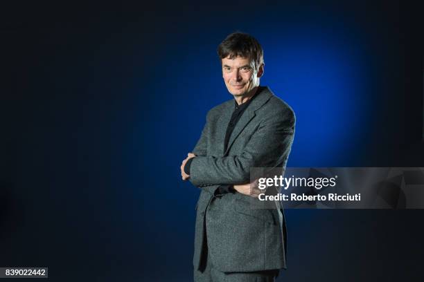 Scottish crime writer Ian Rankin attends a photocall during the annual Edinburgh International Book Festival at Charlotte Square Gardens on August...