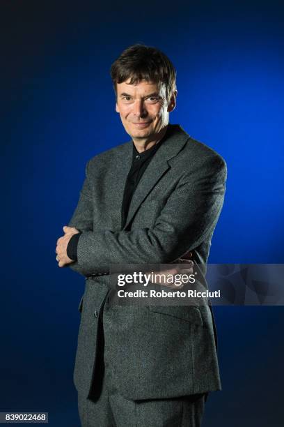 Scottish crime writer Ian Rankin attends a photocall during the annual Edinburgh International Book Festival at Charlotte Square Gardens on August...