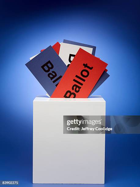ballots stuffed in ballot box - ballot box stock pictures, royalty-free photos & images