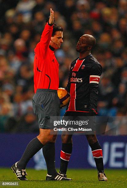 Claude Makelele of Paris Saint Germain protests to Referee Bruno Miguel Duarte Paixao during the UEFA Cup Group A match between Manchester City and...