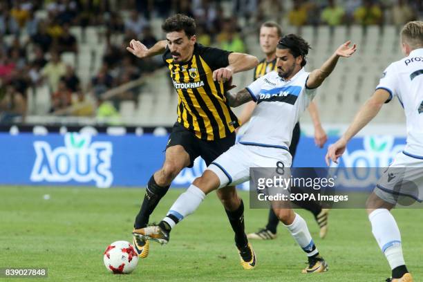 Lazaros Christodoulopoulos in action with Club Brugge's defense player during the UEFA Europa league play-off second leg soccer match between Club...