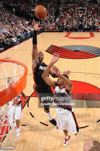 Dwyane Wade of the Miami Heat shoots over LaMarcus Aldridge of the Portland Trail Blazers during the game at The Rose Garden on November 26, 2008 in...