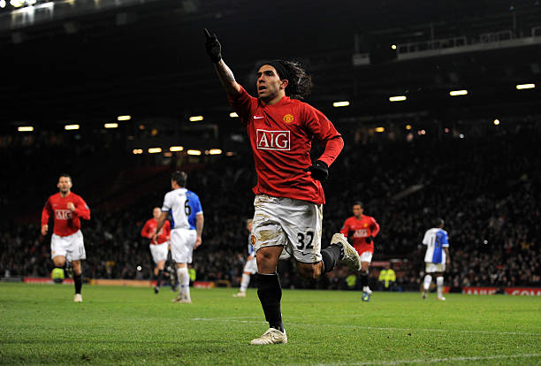 Carlos Tevez of Manchester United celebrates after scoring from the penalty spot during the Carling Cup Quarter Final match between Manchester United...