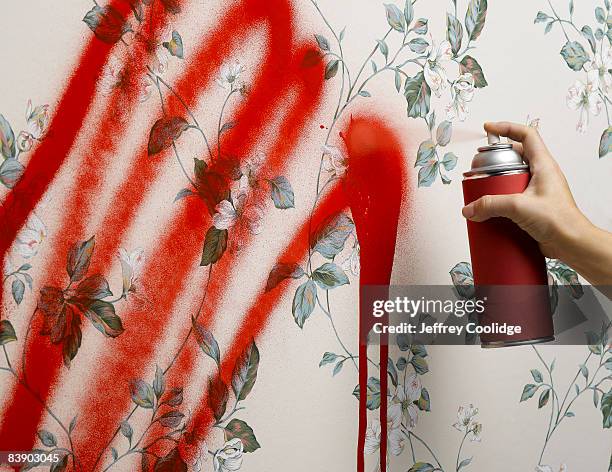 female hand spray painting wallpaper - spraydose stock-fotos und bilder