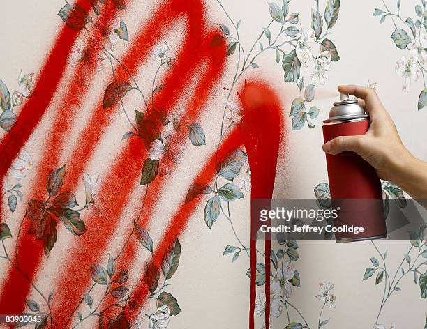 female hand spray painting wallpaper - vandalism 個照片及圖片檔