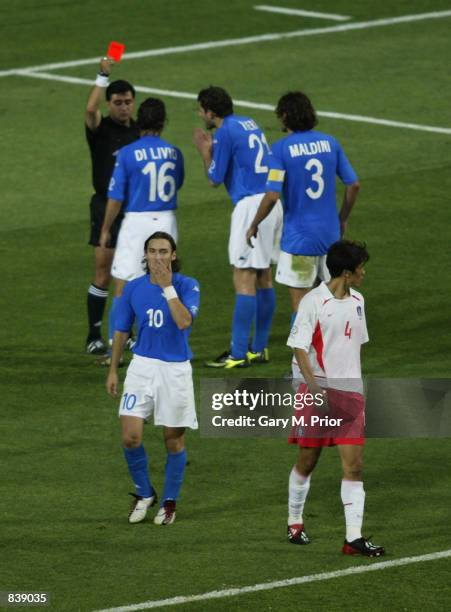 Referee Byron Moreno of Ecuador shows the red card to Francesco Totti of Italy during the FIFA World Cup Finals 2002 Second Round match between South...