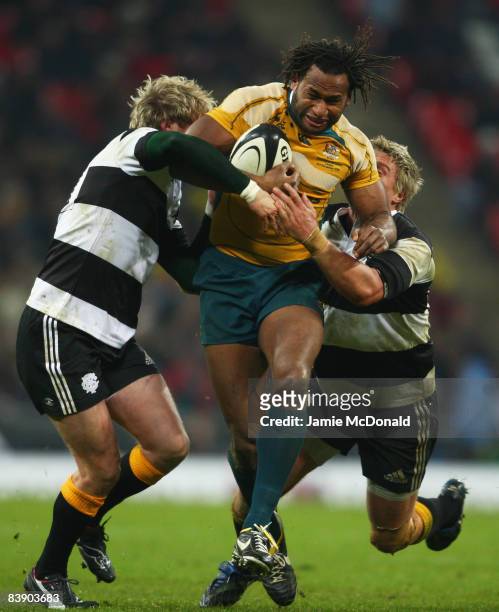 Lote Tuqiri of Australia is tackled by Ollie Smith and Jean De Villiers of The Barbarians during the 1908 - 2008 London Olympic Centenary match...