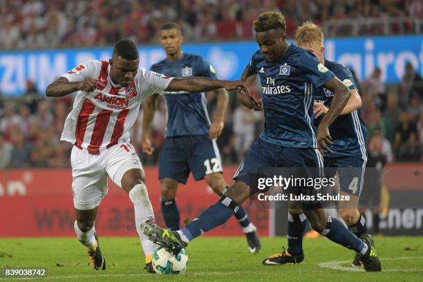 Jhon Cordoba of Koeln fights for the ball with Gideon Jung of Hamburg during the Bundesliga match between 1. FC Koeln and Hamburger SV at...