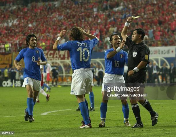 Francesco Totti of Italy is shown his second yellow card for diving by referee Byron Moreno of Ecuador during the FIFA World Cup Finals 2002 Second...