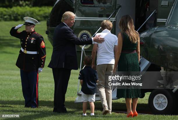 President Donald Trump , first lady Melania Trump , son Barron and grandson Joseph Frederick Kushner about to board the Marine One on the South Lawn...