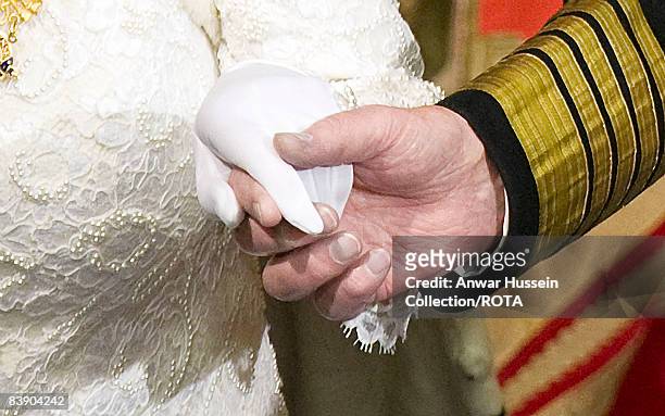 Queen Elizabeth ll and Prince Philip, Duke of Edinburgh hold hands as they attend the State Opening of Parliament on December 3, 2008 in London,...