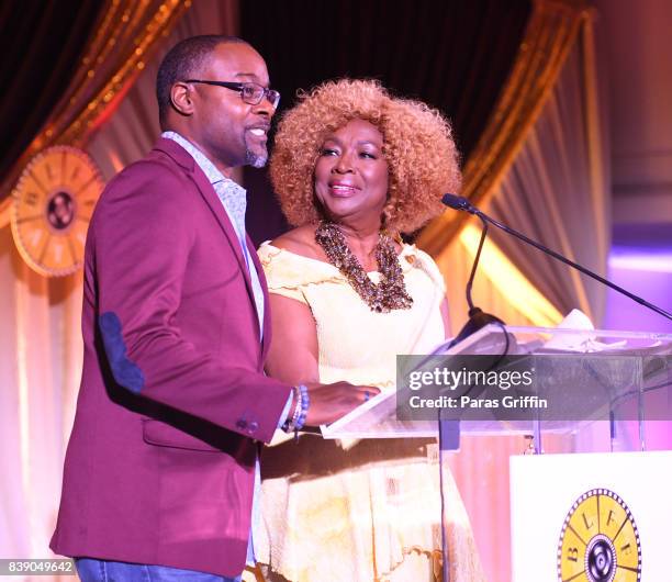 Tirrell D. Whittley and Kathleen Bertrand speak onstage at 2017 BronzeLens Women SuperStars Luncheon at Westin Peachtree Plaza on August 25, 2017 in...