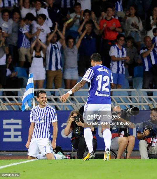 Real Sociedad's midfielder Juanmi celebrates after scoring their third goal during the Spanish league football match Real Sociedad vs Villarreal CF...