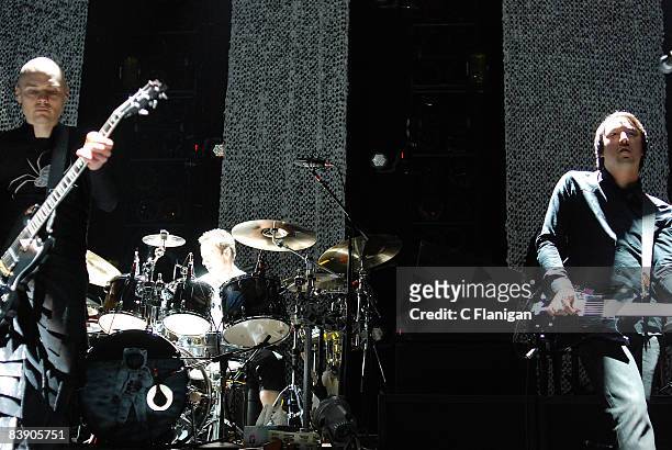 Lead Singer Billy Corgan, Drummer Jimmy Chamberlin and Guitarist Jeff Schroeder of Smashing Pumpkins performs live at the RIMAC Arena on November 30,...