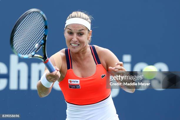 Dominika Cibulkova of Slovakia returns a shot to Elise Mertens of Belgium during Day 7 of the Connecticut Open at Connecticut Tennis Center at Yale...