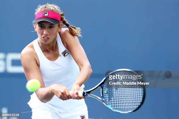 Elise Mertens of Belgium returns a shot to Dominika Cibulkova of Slovakia during Day 7 of the Connecticut Open at Connecticut Tennis Center at Yale...