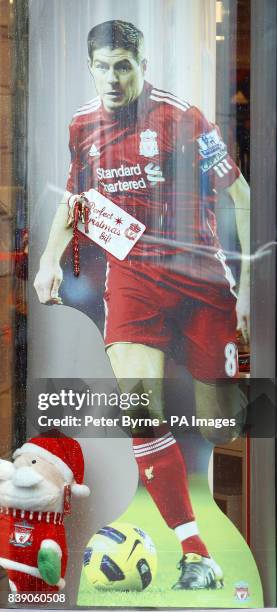 Sign on a cardboard cutout of footballer Steven Gerrard as people shop for Christmas in Liverpool, on what is expected to be one of the busiest...