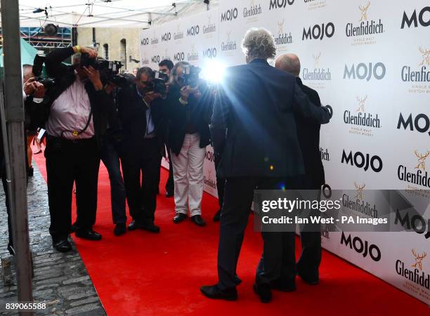 Phil Collins and Bob Geldof arrive at the Mojo Awards, at the Brewery in London.